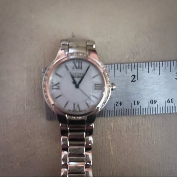 CITIZEN ECODRIVE SILVER TONE BRACET WATCH W/ TINY DIAMOND CHIP ACCENTS. - Picture 10 of 16